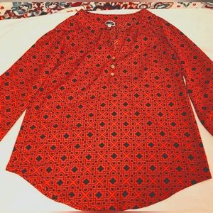 A Red and Black Blouse with a Chorographic Print. 100% Polyester, Size: Small